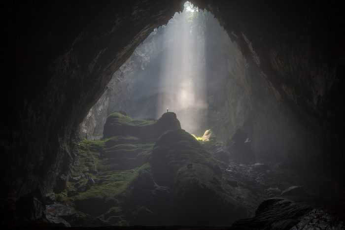 Sunbeam inside dark Son Doong cave in Phong Nha-Ke Bang National Park, Quang Binh Province, Vietnam