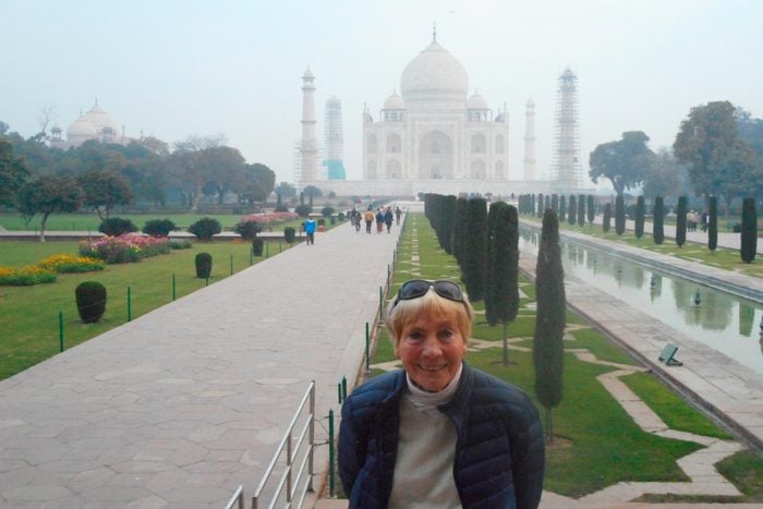 woman with taj mahal in the background