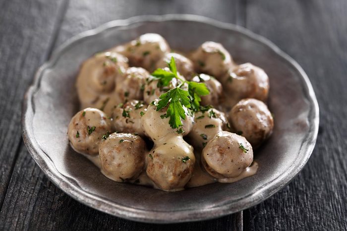 swedish meatballs with parlsey on gray slate