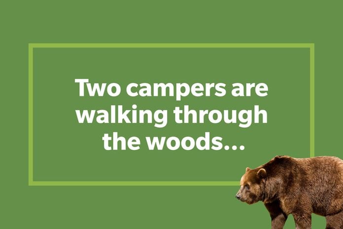 Two campers are walking through the woods...
