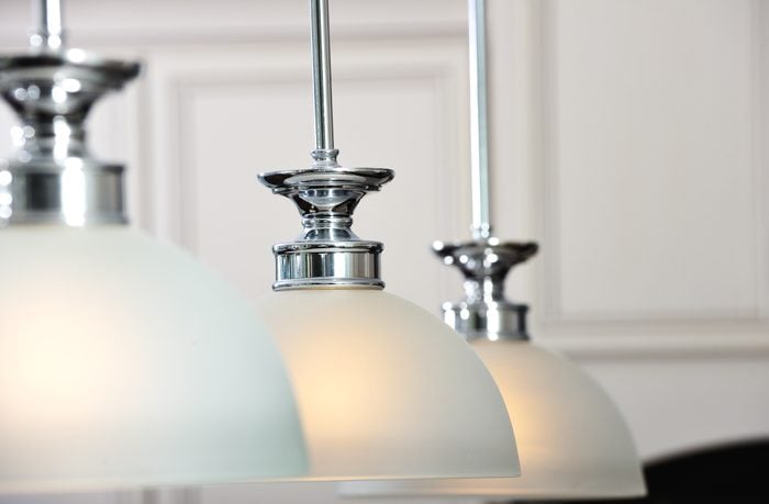 Interior ceiling lighting fixtures with white semi-spherical covers
