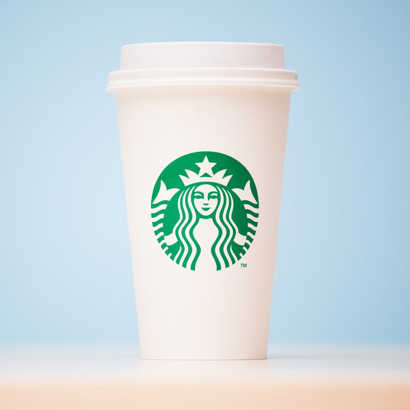 Grande Starbucks to go cup on table