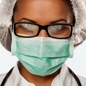doctor wearing mask with foggy glasses