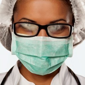 doctor wearing mask with foggy glasses