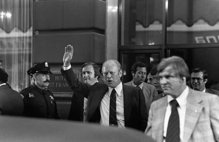 President Gerald Ford waves moments before shots were fired by Sara Jane Moore.