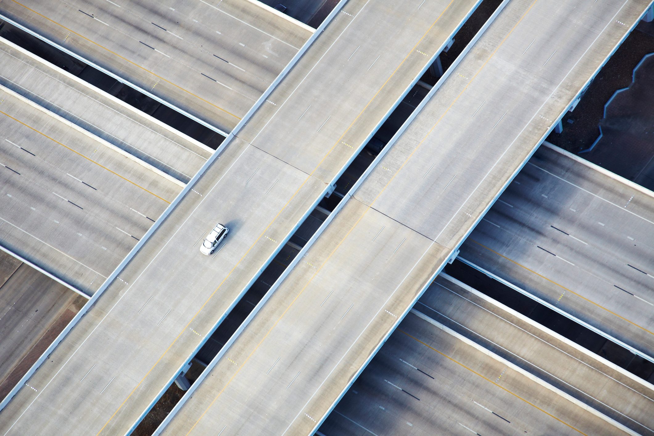 Aerial shot of one car on freeway