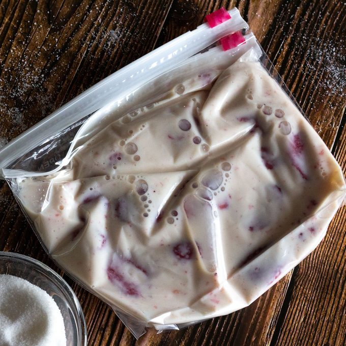 Strawberry ice cream mixture in a bag.