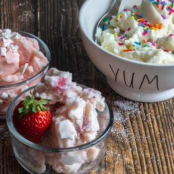 Strawberry, vanilla and peppermint ice cream in dishes.