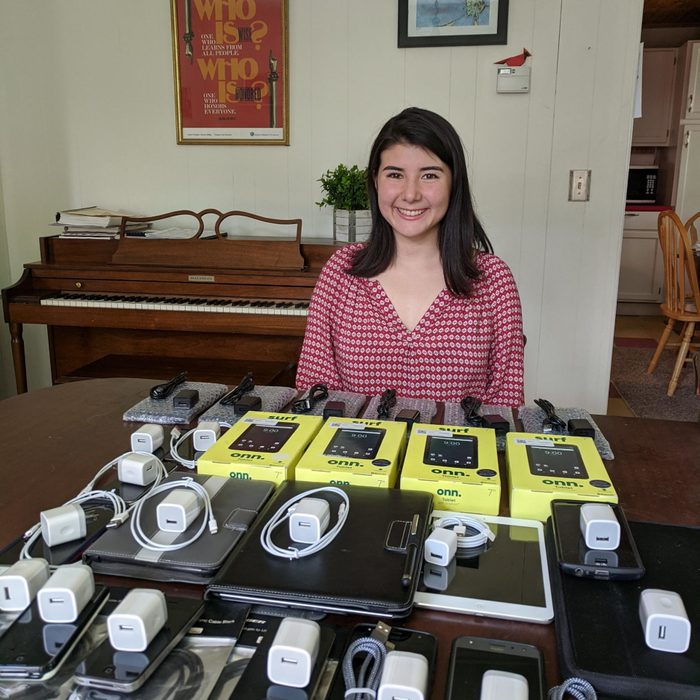 lia rubel posing with an array of collected devices