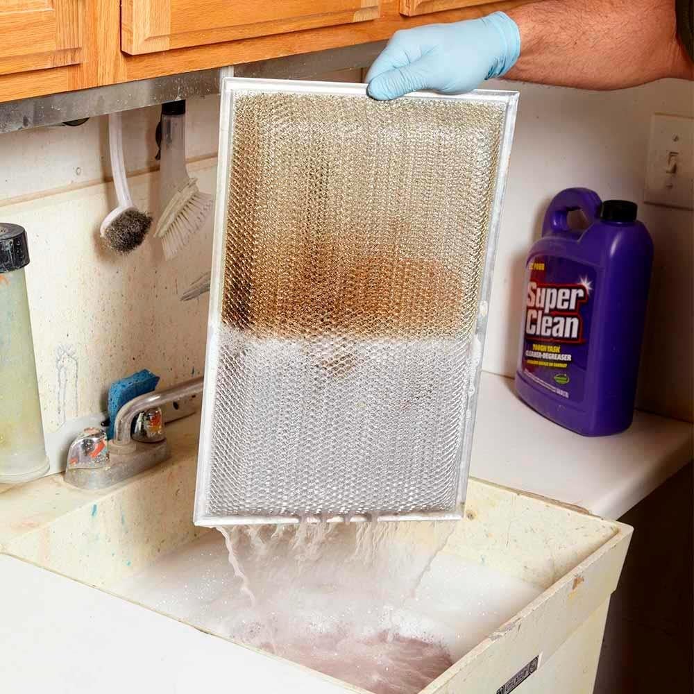 Clean range hood grease filters with a degreaser