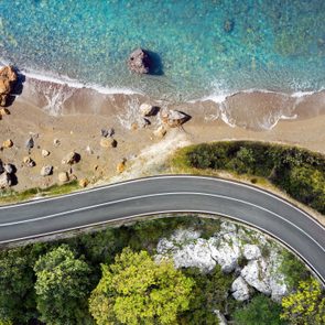 Seaside road approaching a beach, seen from above