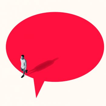 Man walking out from vibrant red speech bubble