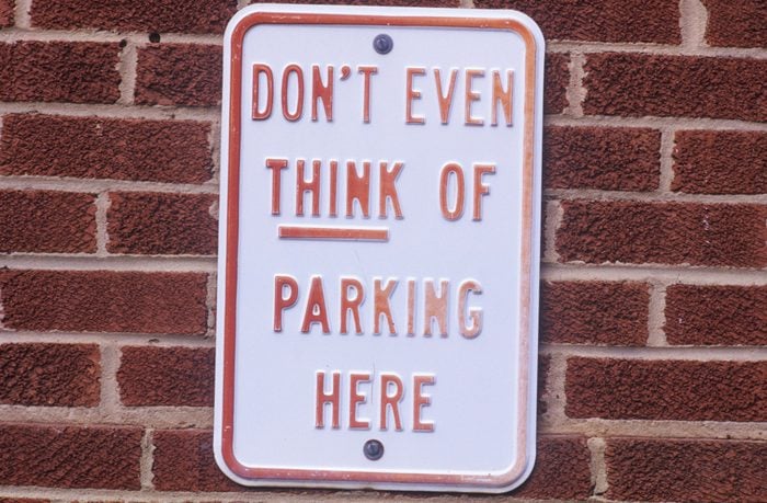 A sign that reads "Don't even think of parking here"