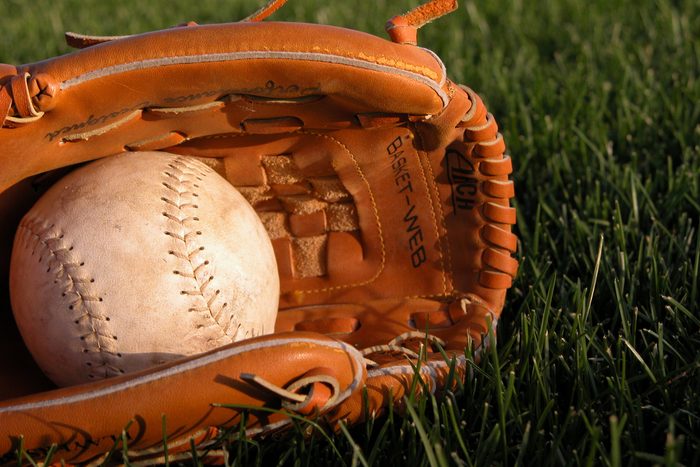 Baseball Glove Holding Softball