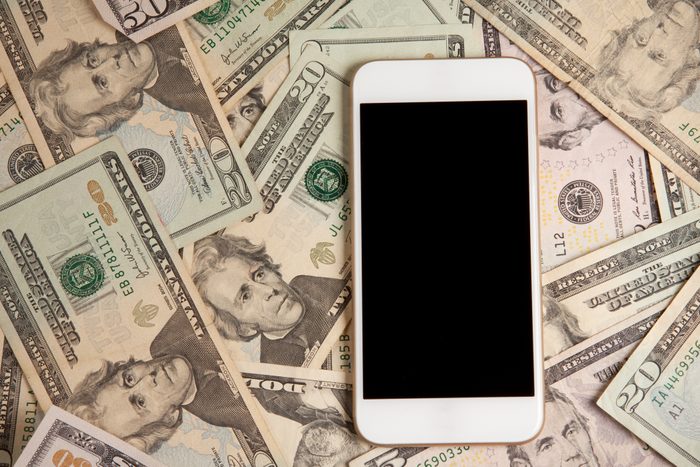 Smart Phone Laying On Money