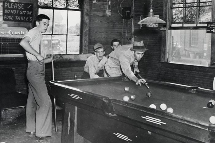 group of men playing billiards in new york city