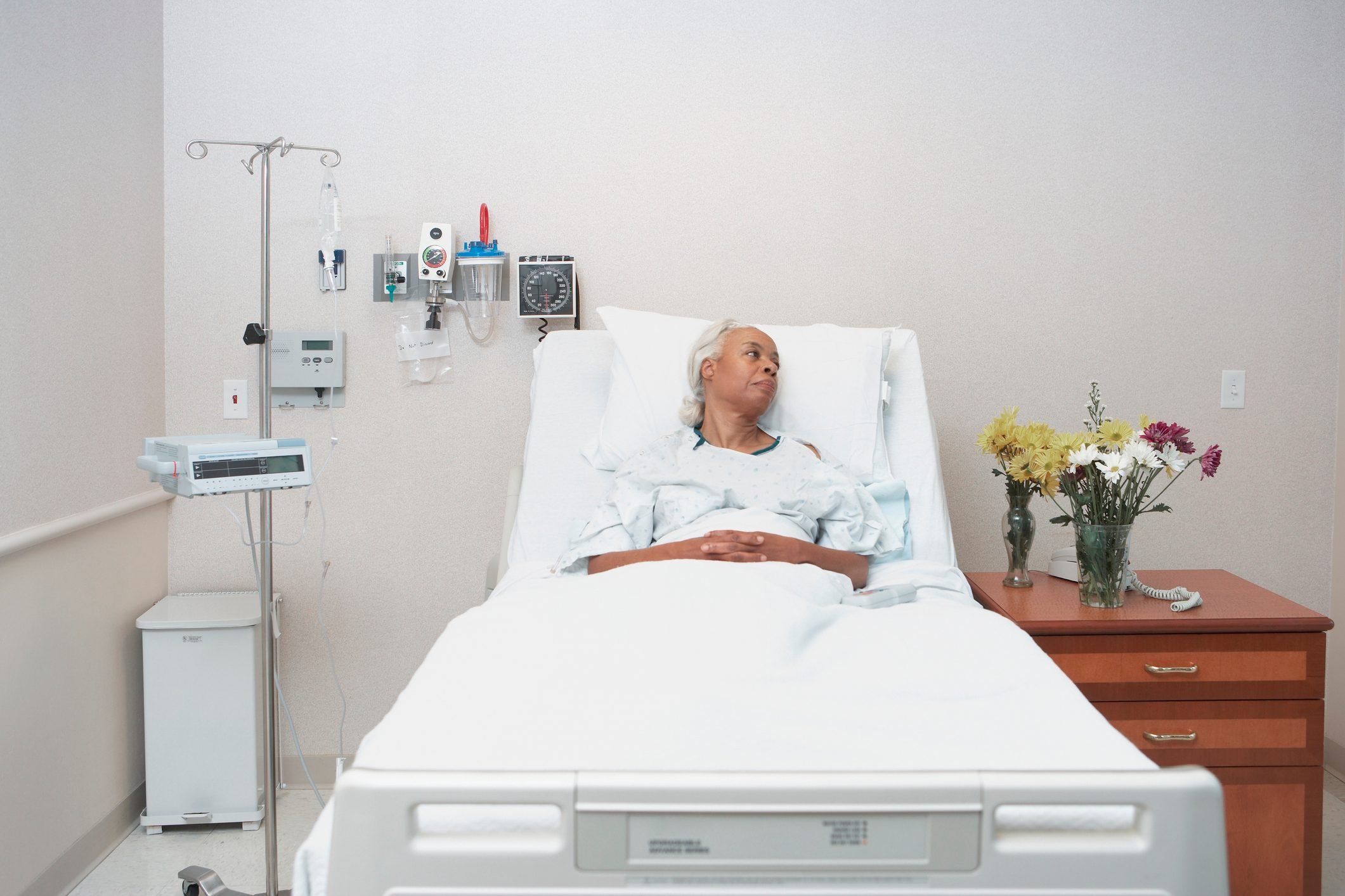 black woman laying in hospital bed