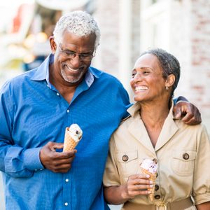 African American Senior Couple On the Town with Ice Cream