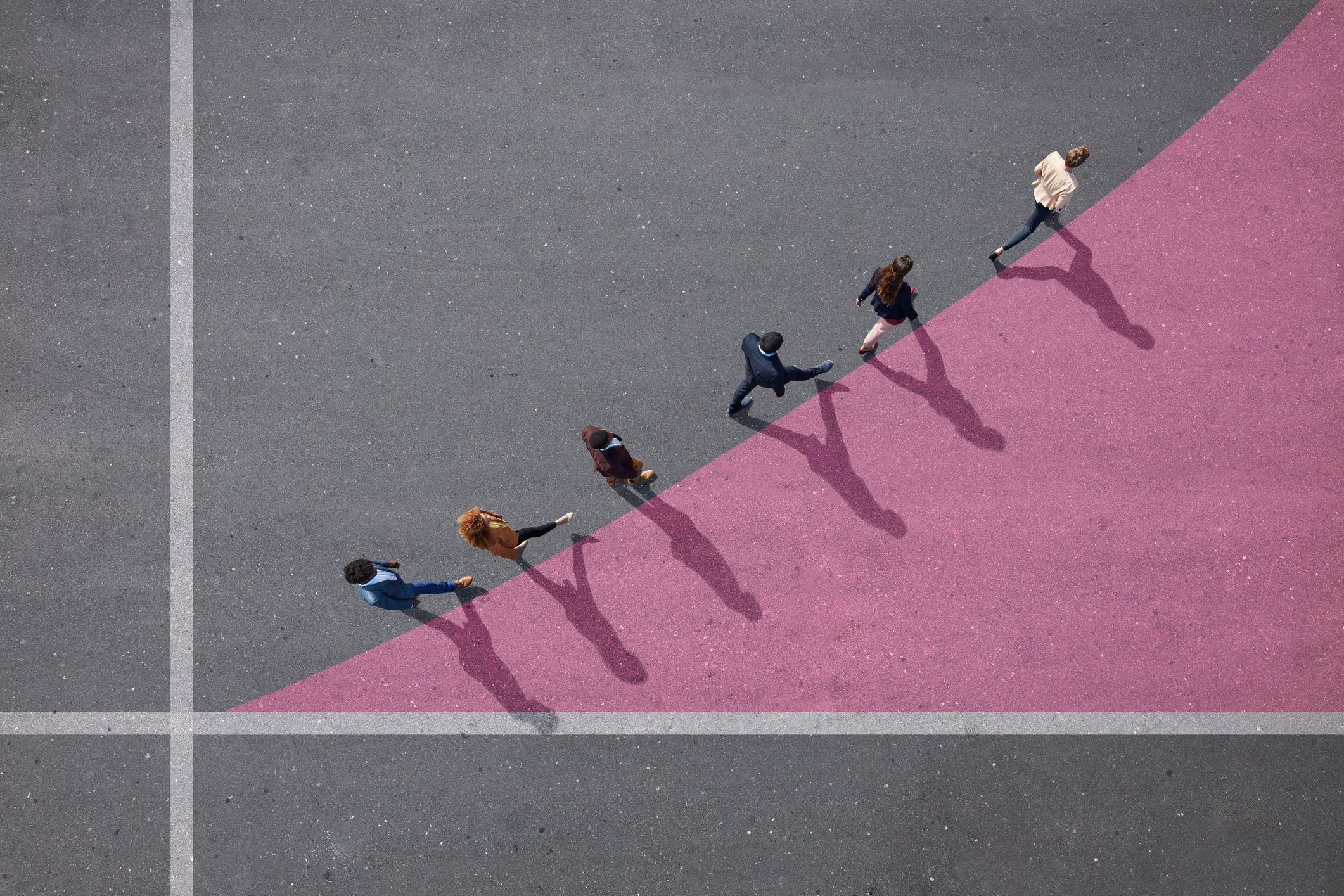 view from above of people walking on pink graph curve