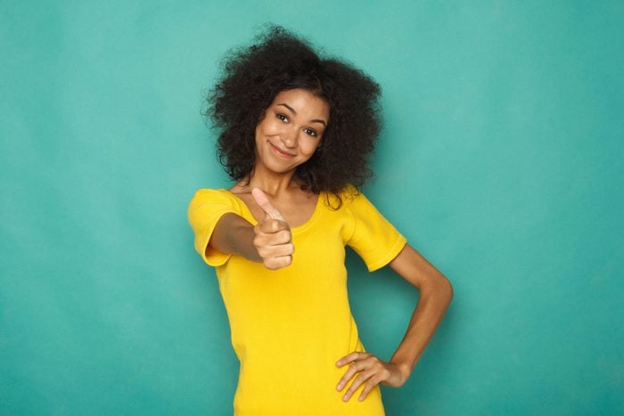 Young beautiful woman with thumb up portrait