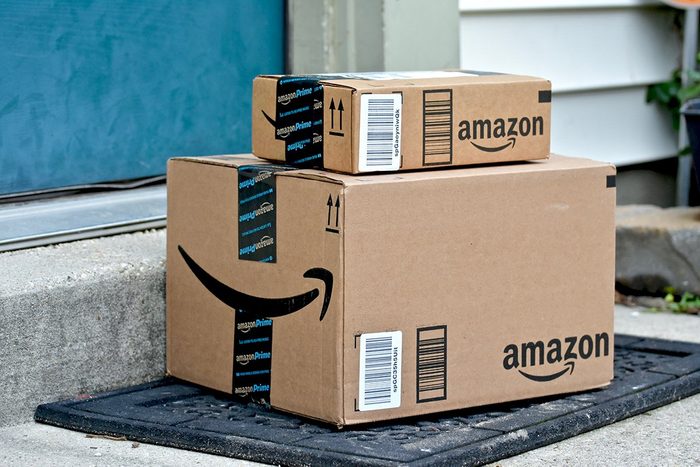 Odenton, United States of America - February 4, 2016: Amazon packages delivered to the front door of a home. Amazon is the largest internet based retailer in the United States.