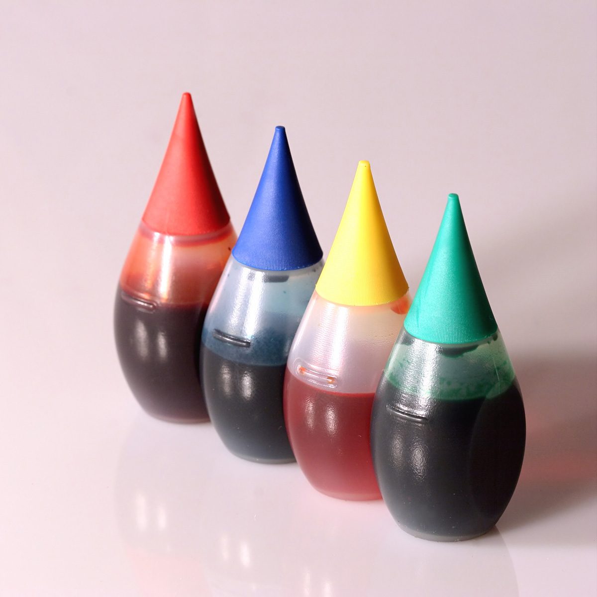 Four bottles of food coloring.