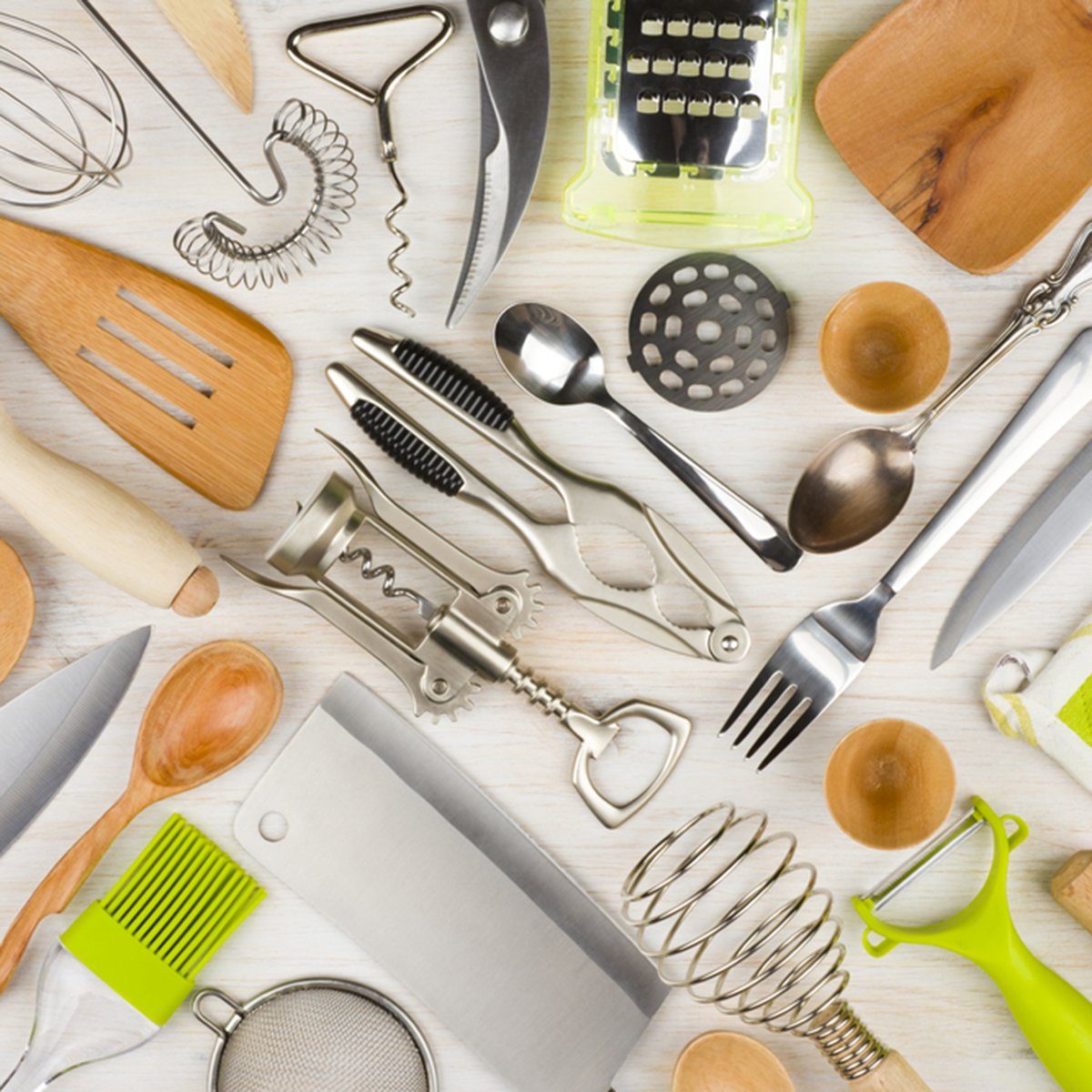 Background of kitchen utensils on wooden kitchen table