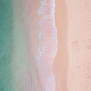 Sea, waves and pink sand