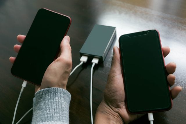 Friends Share Portable Battery to Charge Smart Phones