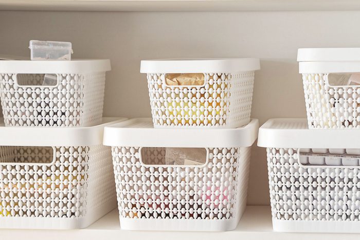 stackable white plastic bins for organizing a kitchen