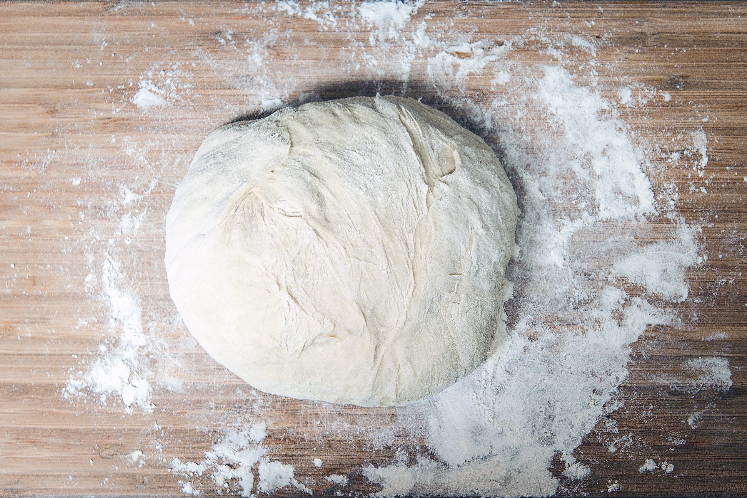 Bread dough on floured surface