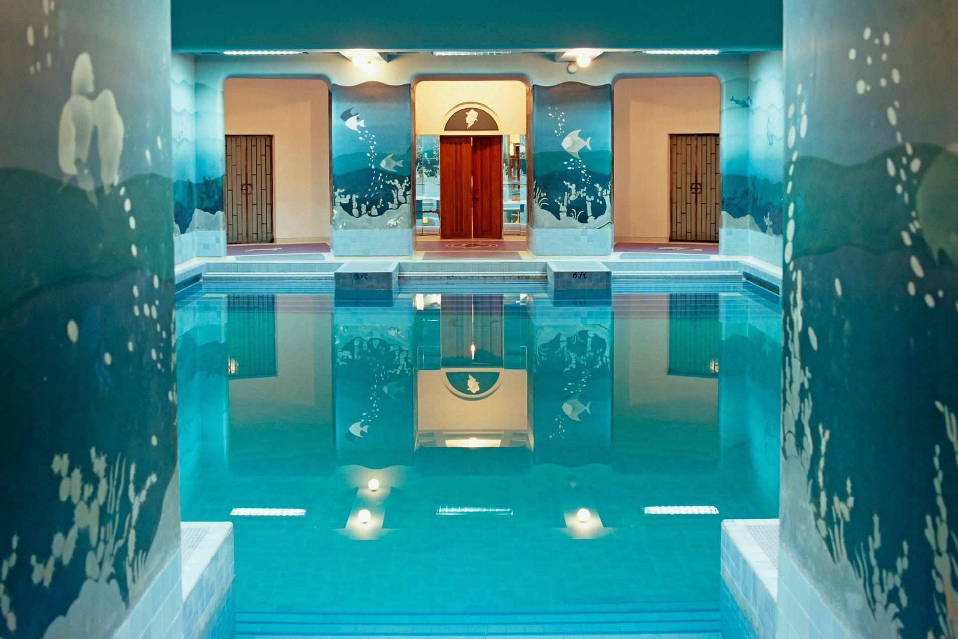 Seascape murals painted on the walls of the indoor swimming pool of Umaid Bhawan Palace