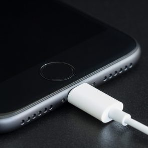 Close-up iPhone 7 matte black connect to usb cable