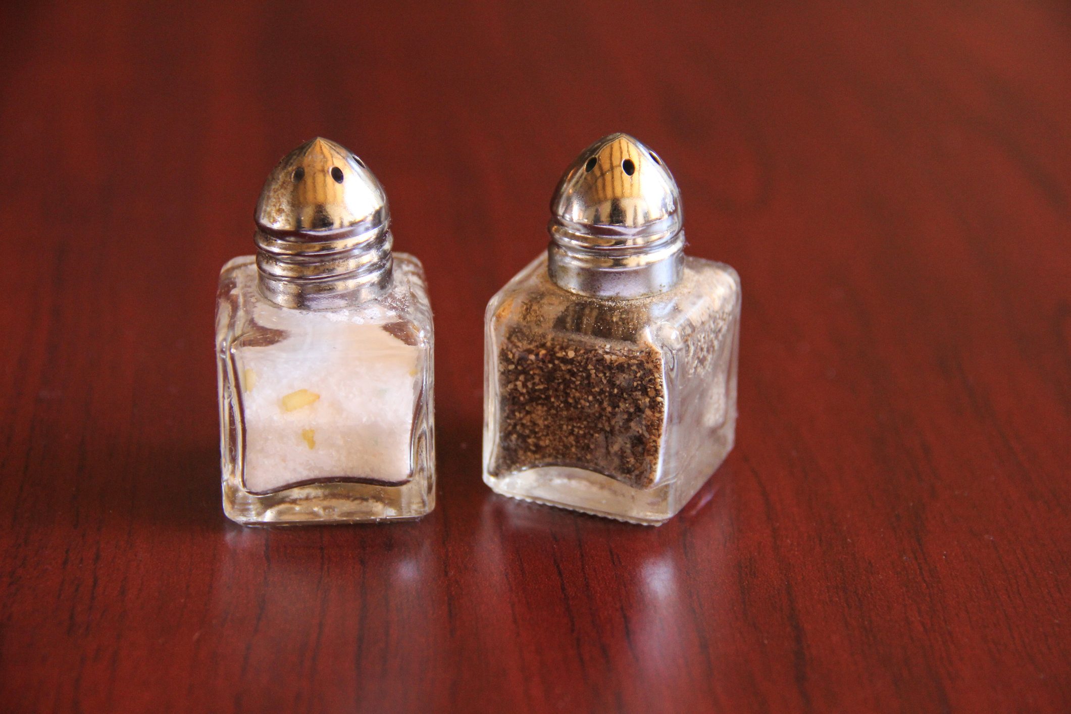 Salt and pepper shaker on table