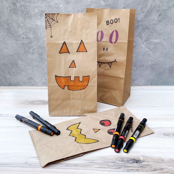 Paper Bag Jack O Lanterns Kids Halloween Craft displayed with markers