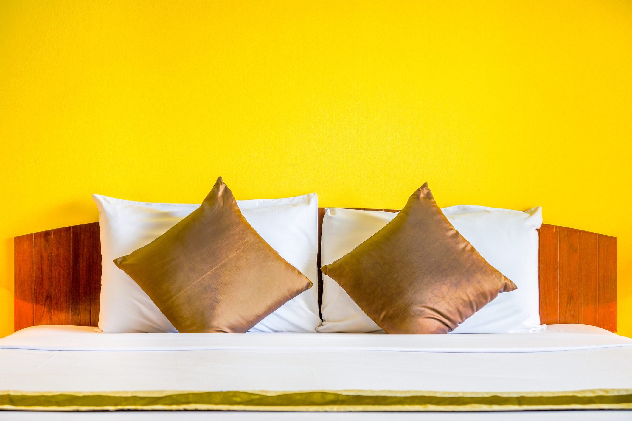 Interior decoration of romantic plain yellow bedroom.