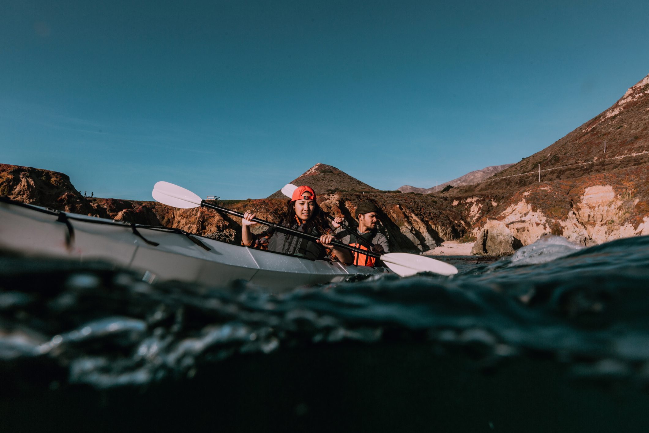 Friends kayaking in sea, Big Sur, California, United States