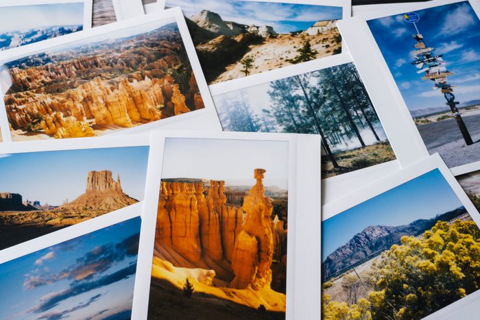 Collection of instant travel holiday photos on a table