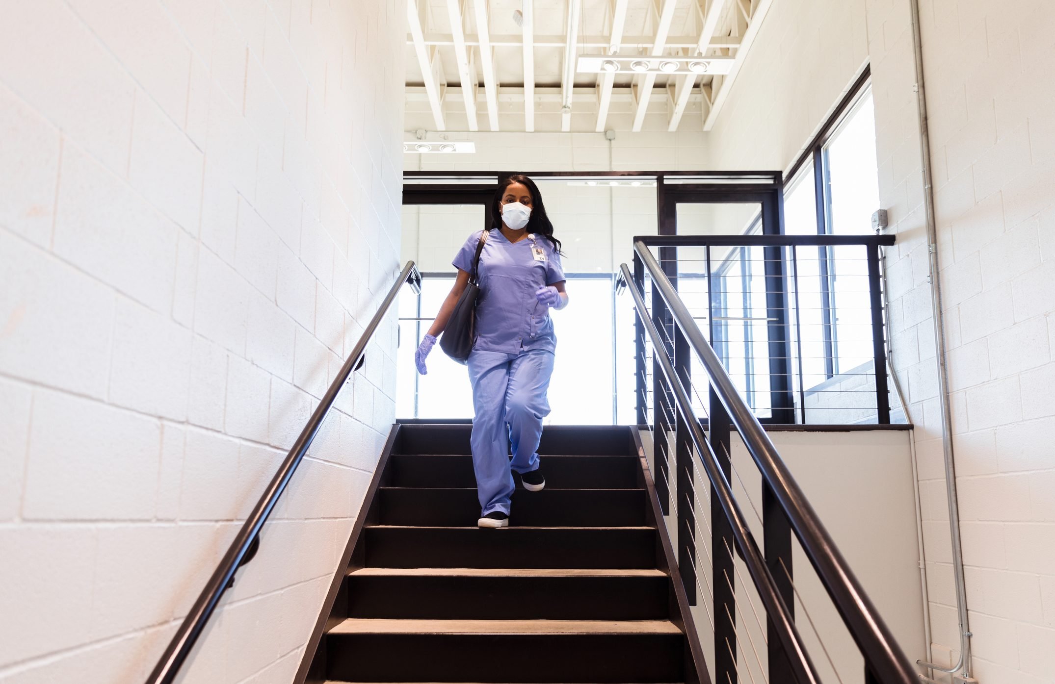 Nurse uses staircase in hospital during COVID-19 pandemic