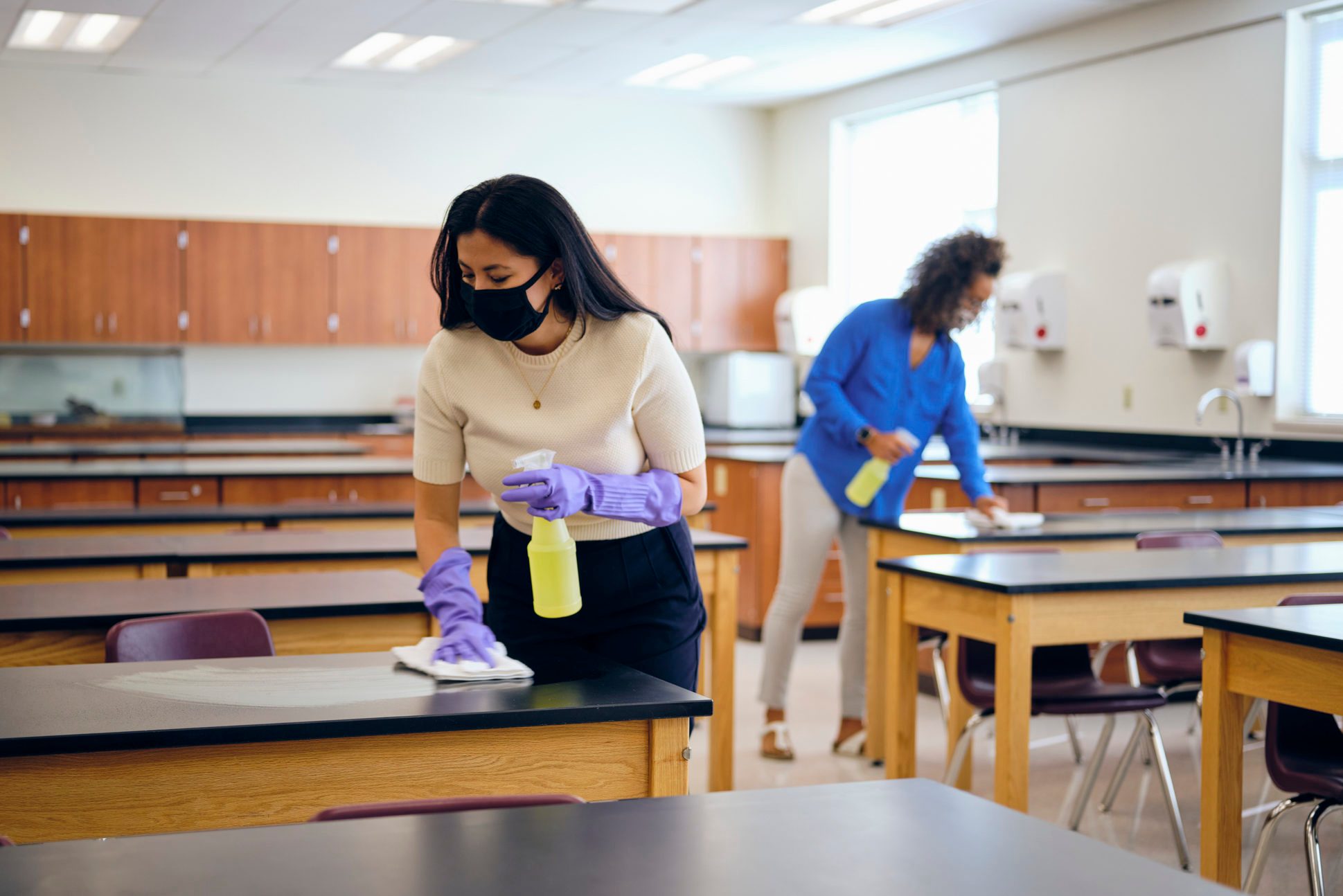 School Teachers Cleaning a Classroom