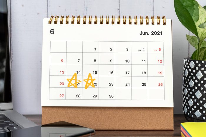 calendar of June 2021 on a desk with the 21st and 22nd marked with stars for amazon prime day