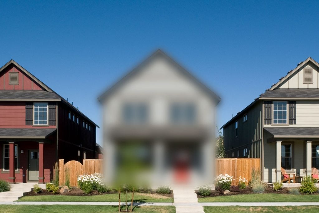 row of houses with center house blurred