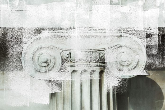 white paint overlay over a close up of details of a marble column
