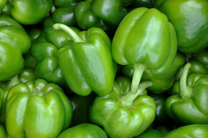 A close-up of a bunch of green peppers