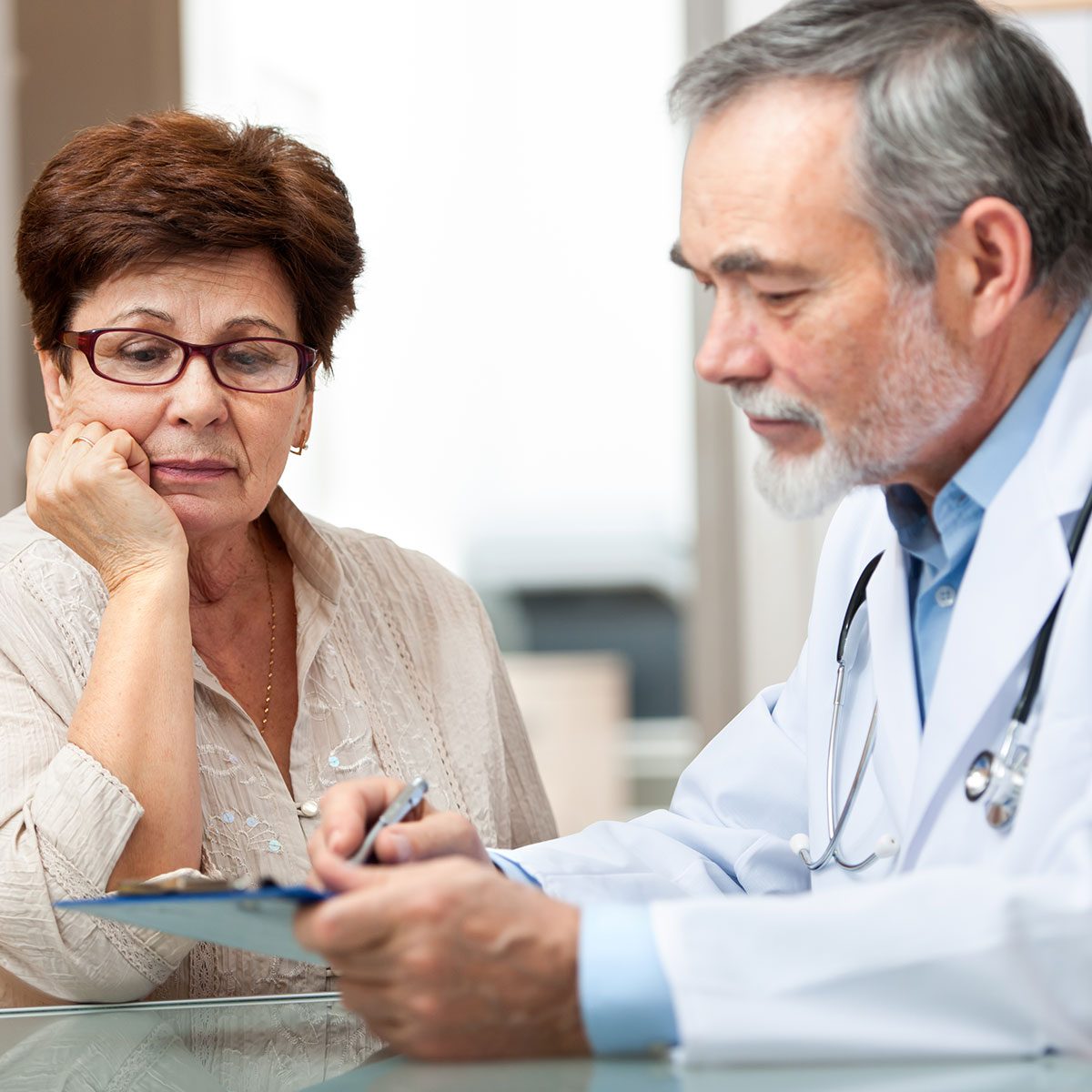 Doctor explaining results to elderly patient
