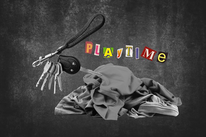 Pile Of Clothing Next To Key Ring With Text Playtime