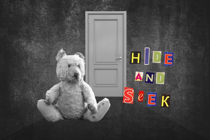 Teddy Bear Sitting In Hallway With Text Hide And Seek