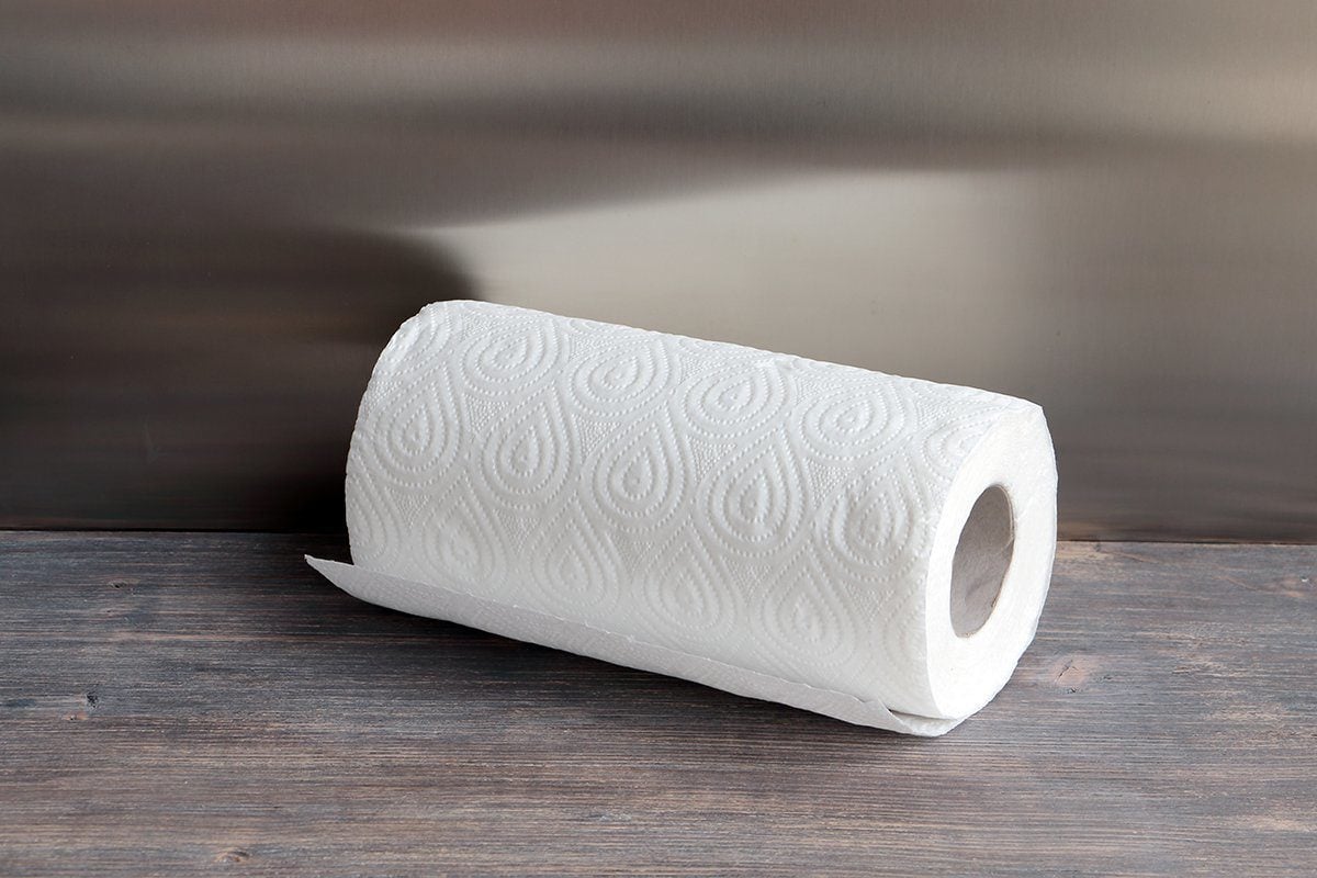 https://www.rd.com/wp-content/uploads/2020/09/white-kitchen-paper-towel-on-wooden-table-591444516-e1599755781637.jpg