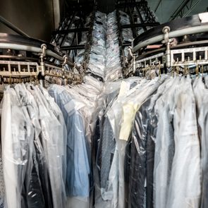 Conveyor belt at an industrial laundry service with clean clothes