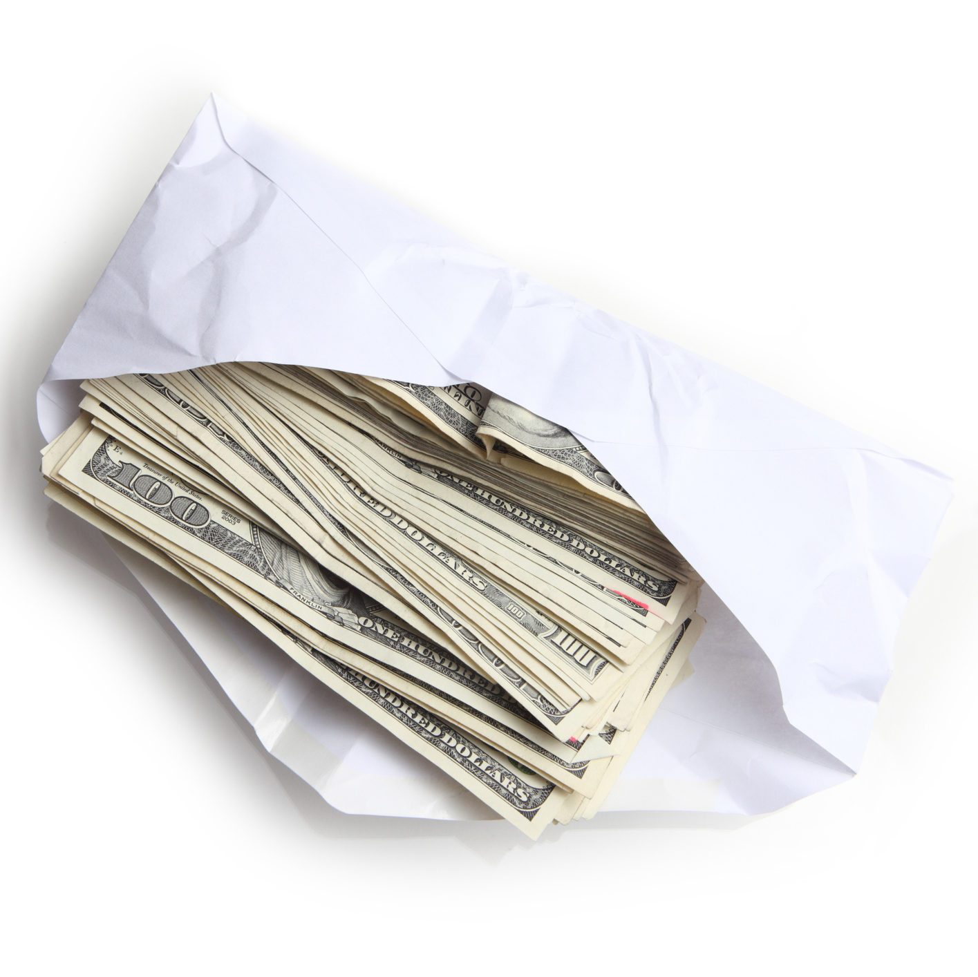 Envelope filled with stack of hundred dollar bills